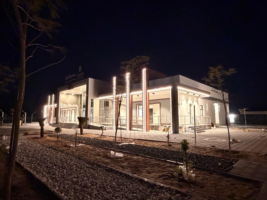 Score Construct illuminated building exterior at night